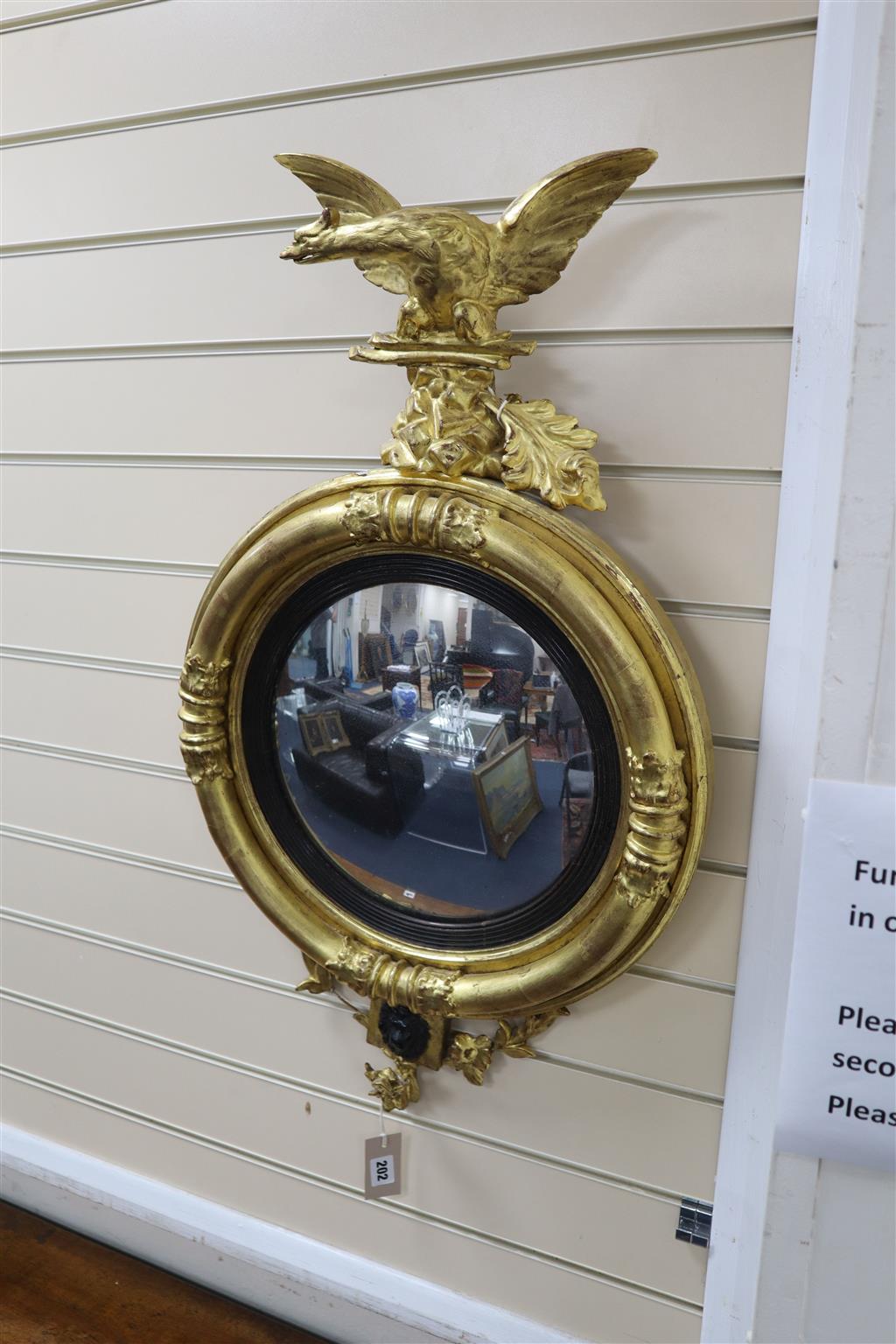 A Regency giltwood convex wall mirror, width 46cm, height 84cm